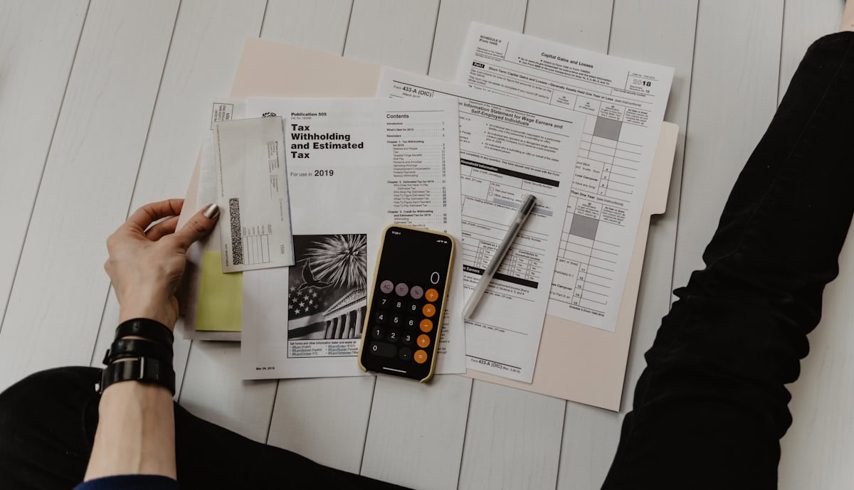 Person reviewing finances while arranging debt review removal in South Africa